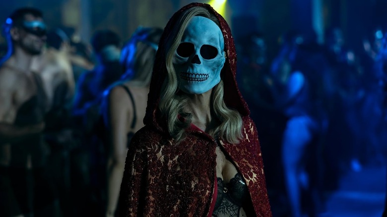 A woman wearing a skull mask in The Fall of the House of Usher