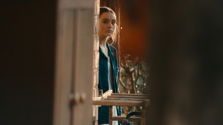 Chloe Jean Lourdes's Sarah Reid looks out from behind a wall in Last Seen