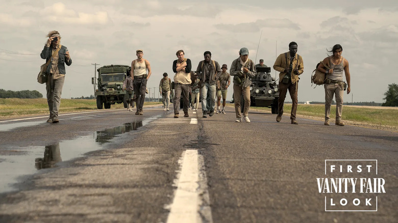 Charlie Plummer's Gary Barkovitch, Garrett Wareing's Stebbins, Cooper Hoffman's Ray Garraty, David Jonsson's Peter McVries, Ben Wang's Hank Olson, Tut Nyuot's Arthur Baker, and Joshua Odjick's Collie Parker walking in The Long Walk