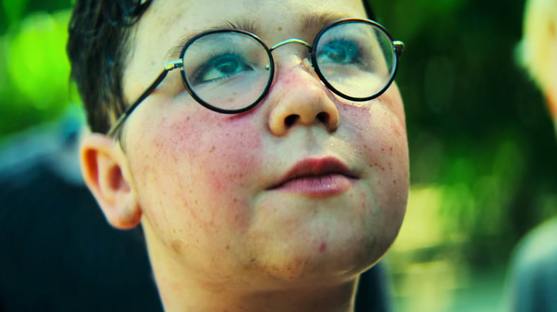 David McKenna's Piggy is seen in closeup as he looks up in Lord of the Flies