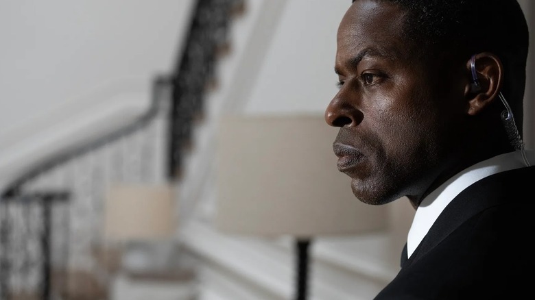 Xavier Collins looks alert while doing his job in Season 1 of Paradise