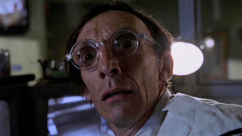 A doctor in think glasses looking scared on Kingdom Hospital