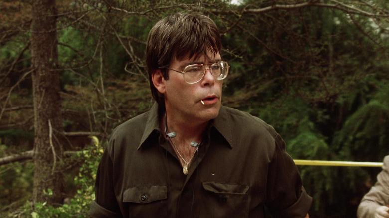 Stephen King's Cemetery Caretaker is seen with a toothpick in his mouth at a crime scene in the woods in Sleepwalkers