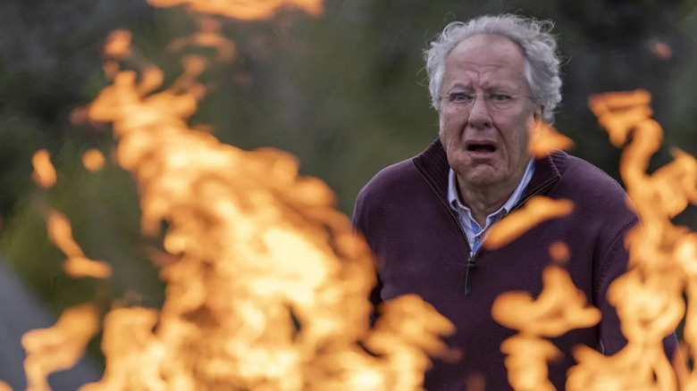 Stefan looking at a fire in utter terror in The Rule of Jenny Pen
