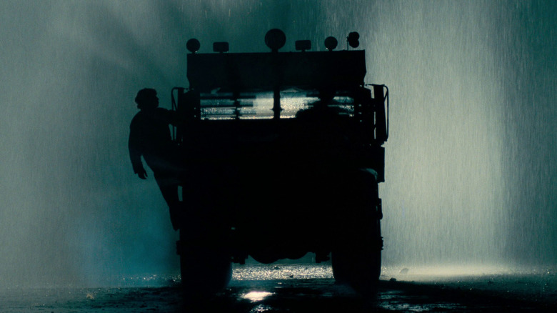 A truck standing still at night in the rain in Sorcerer