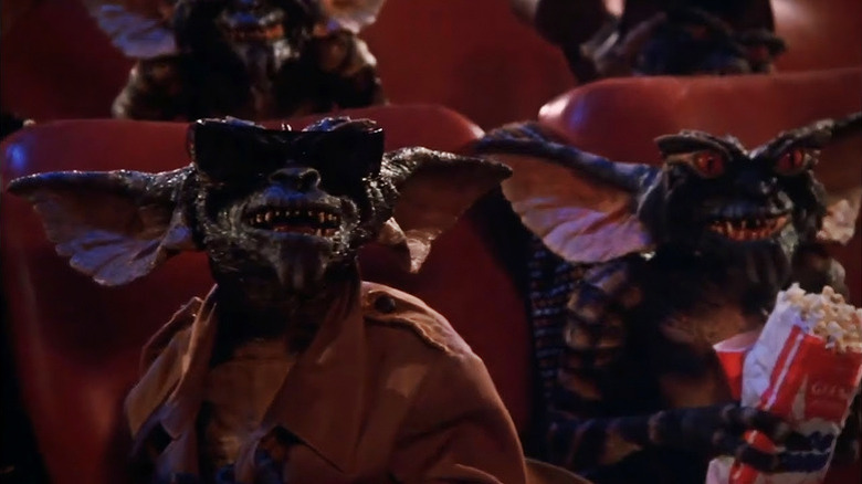 Gremlins - Gremins watching a movie and eating popcorn