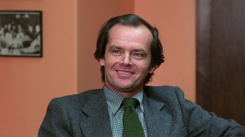 Jack Torrance smiling in an office in The Shining