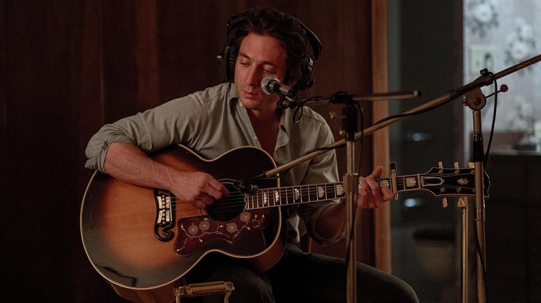 Jeremy Allen-White as Bruce Springsteen recording in a studio booth in Deliver Me from Nowhere