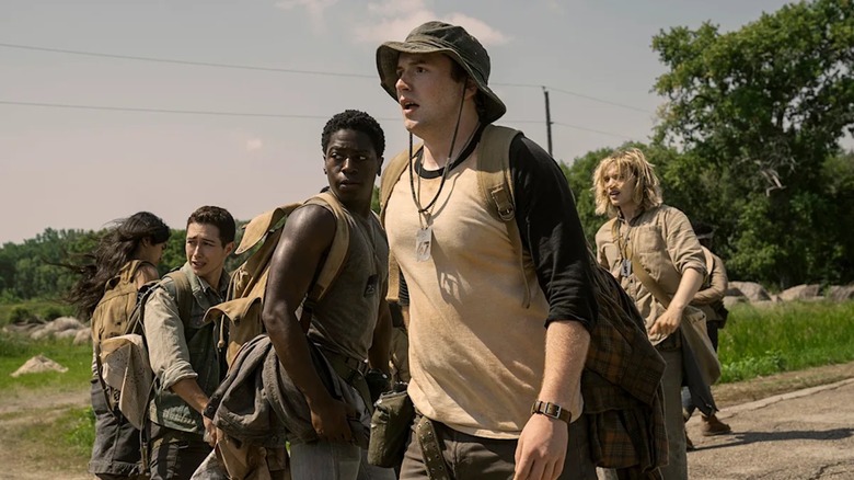Cooper Hoffman as Raymond Garraty, David Jonsson as Peter McVries, Jordan Gonzalez as Richard Harkness, Charlie Cooper as Gary Burkovitch and Joshua Odjick as Collie Parker looking distraught in The Long Walk