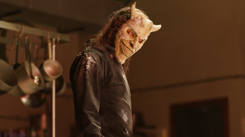 Ethan Hawke as The Grabber standing in the kitchen in Black Phone 2