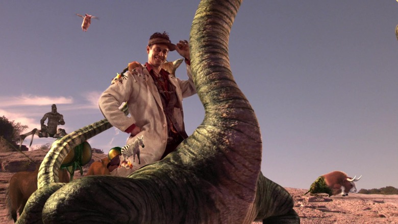 Romero riding a mutant hybrid surrounded by a bunch of animals in Spy Kids 2: The Island of Lost Dreams