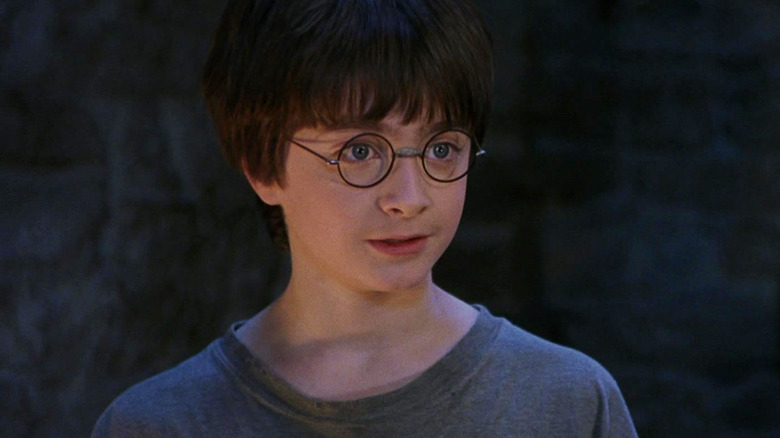 Daniel Radcliffe as Harry Potter looking surprised in Harry Potter and the Sorcerer's Stone