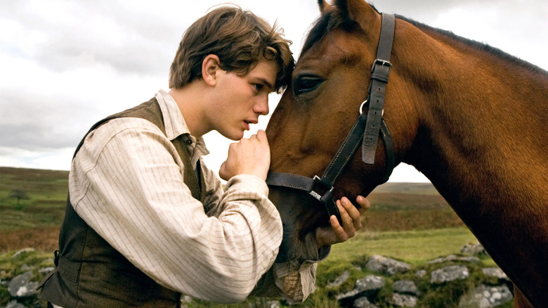 Jeremy Irvine petting horse War Horse