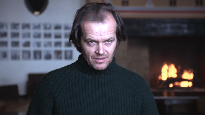 Jack Nicholson's Jack Torrance stands in the Overlook hotel dining room delivering the Kubrick stare in The Shining