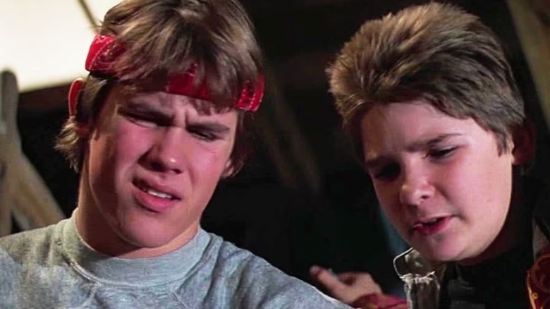 Josh Brolin as Brand Walsh and Corey Feldman as Clark "Mouth" Devereaux look perplexed in The Goonies