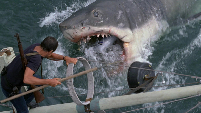 Chief Brody battling a giant shark in the water in Jaws