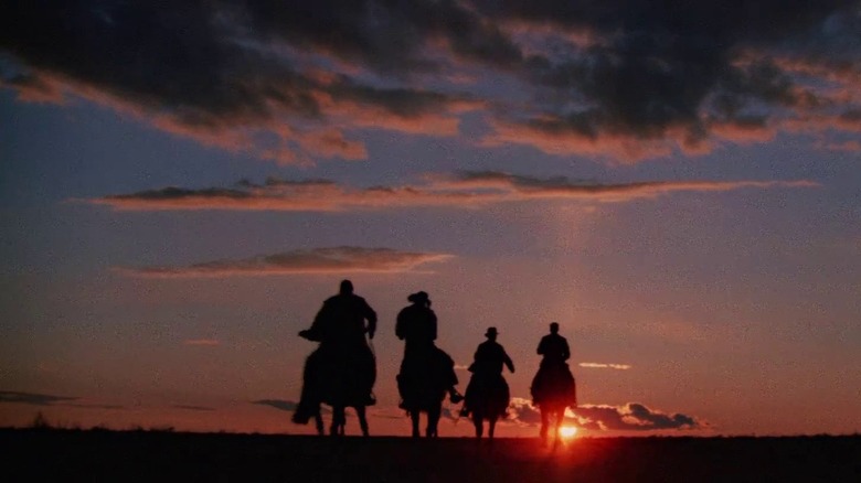 Indiana Jones and his gang riding off into the sunset on horses in Indiana Jones and the Last Crusade