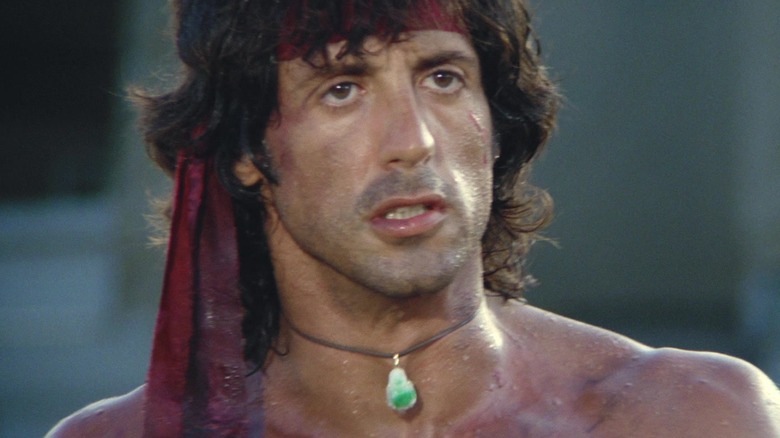 Sylvester Stallone's John J. Rambo is seen in closeup wearing a bandana in Rambo First Blood Part II.jpg