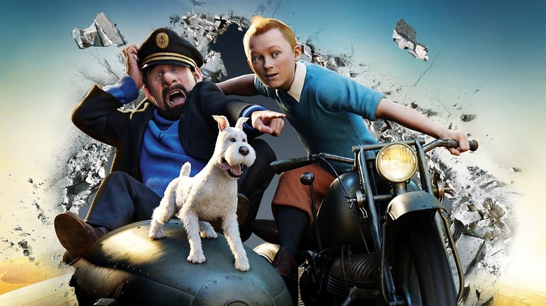 Andy Serkis as Captain Archibald Haddock, Jamie Bell as Tintin, and Snowy riding a motorbike together in "The Adventures of Tintin"