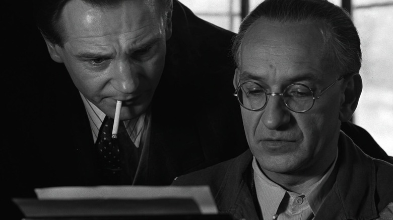 Oskar Schindler and Itzhak Stern typing out the list in Schindler's List