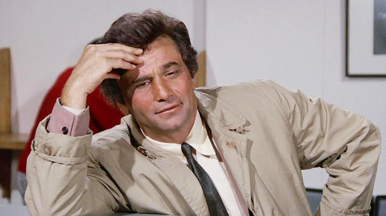 Columbo sitting down and leaning on his hand on Columbo