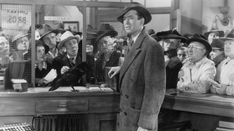 George Billy at the bank next to a crow, with a crowd of people in a wonderful life.