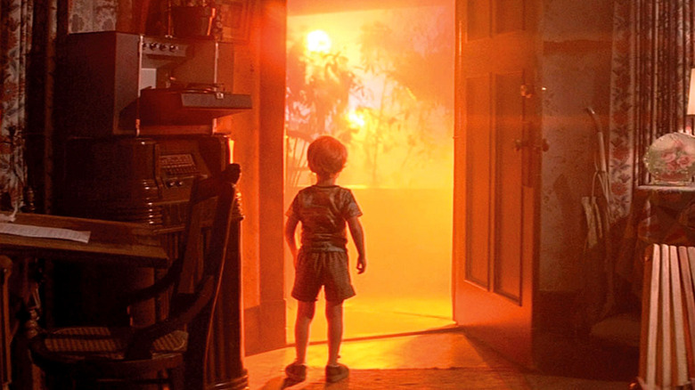 A child looking at a spaceship outside his front door in Close Encounters of the Third Kind