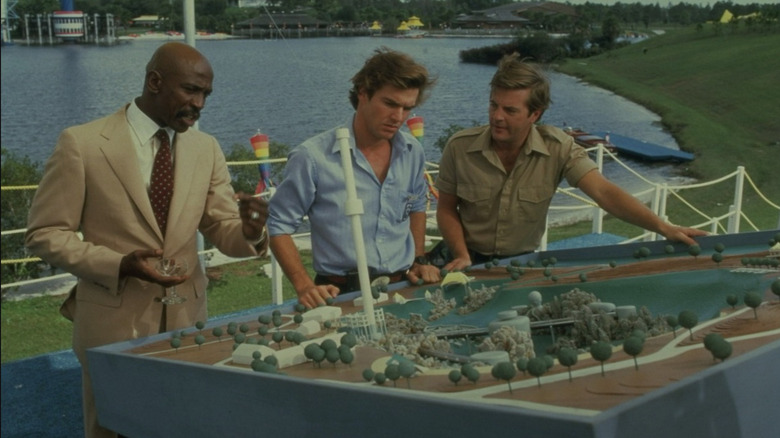 Calvin, Michael and the guard pass where the shark can attack in Jaws 3D