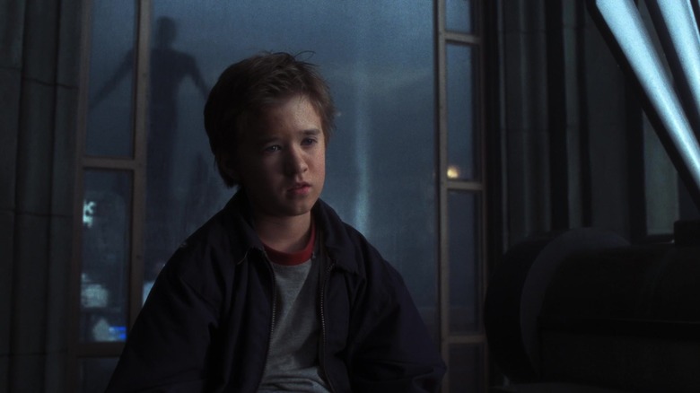 David looking melancholy next to a window in A.I.