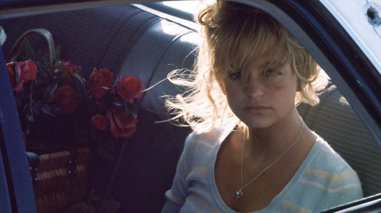 Lou Jean rides with some roses in The Sugarland Express