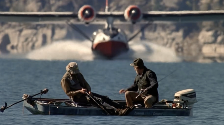 Two fisherman are alarmed to see a firefighting plane speeding right toward them in Always