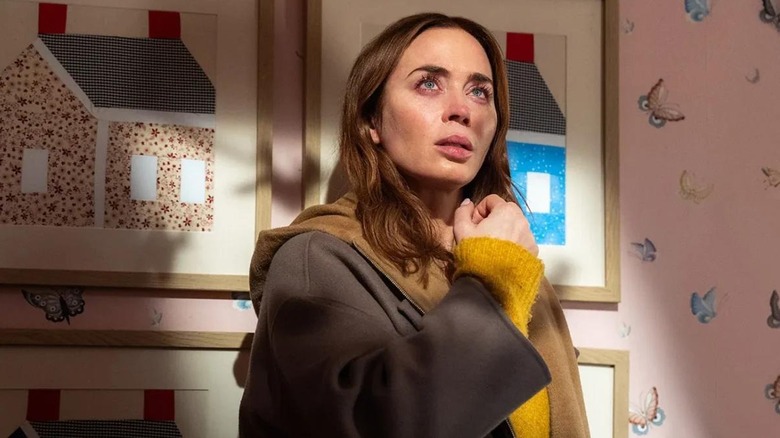 Emily Blunt as Margaret standing in the recreation of her bedroom in Disclosure Day
