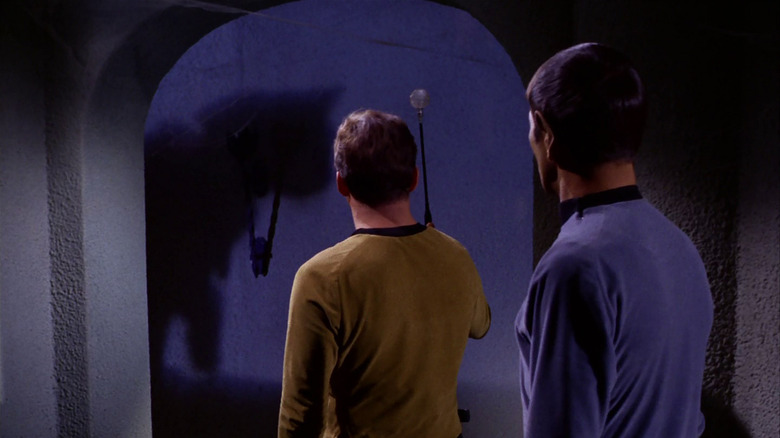 Star Trek, 'Catspaw,' Kirk and Spock looking at shadow of giant black cat