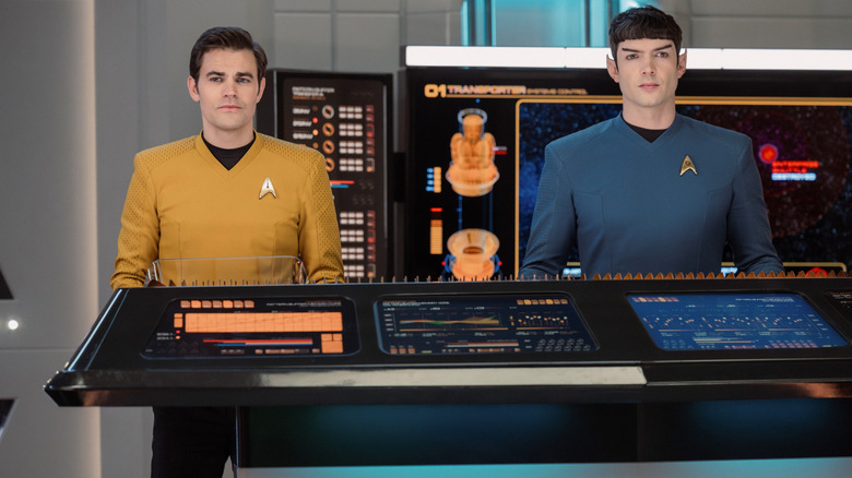Paul Wesley as James T. Kirk and Ethan Peck as Spock standing by a console in Star Trek: Strange New Worlds