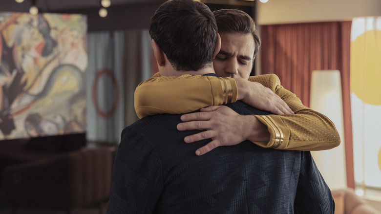 Paul Wesley as James T. Kirk and Ethan Peck as Spock embracing each other in Star Trek: Strange New Worlds