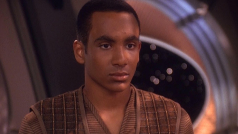 Cirroc Lofton in the role of Jake Sisko on Star Trek: Deep Space, it looks somewhat upset