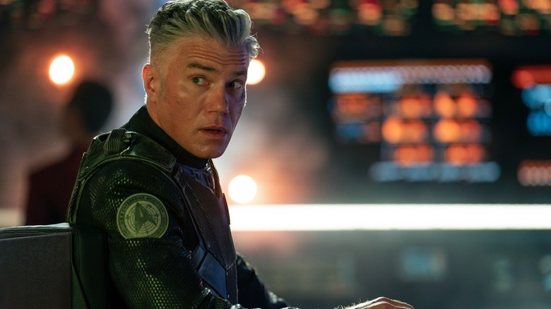 Captain Pike on the bridge of the Enterprise in his spacesuit on Star Trek: Strange New Worlds.
