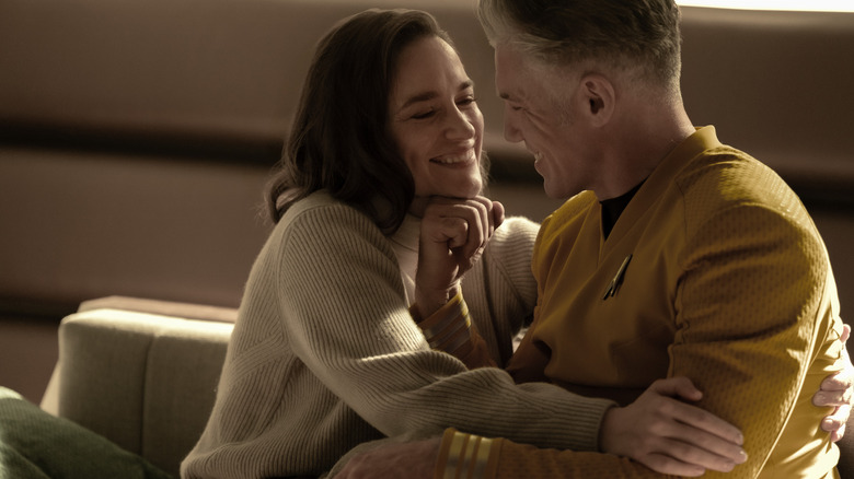 Melanie Scrofano as Marie Batel and Anson Mount as Christopher Pike sharing an embrace in Star Trek: Strange New Worlds