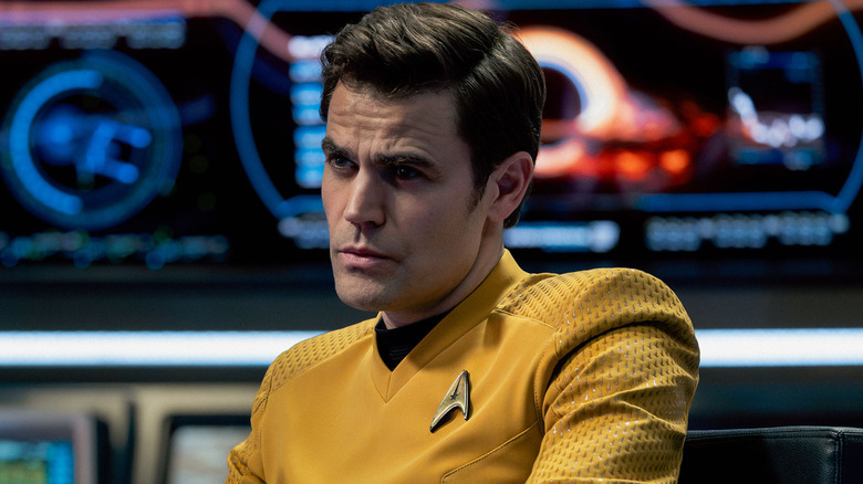 Captain Kirk sitting in Enterprise bridge captain's chair in Star Trek: Strange New Worlds