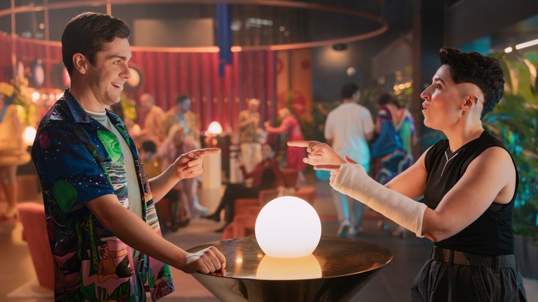 Scotty and Ortegas in vacation clothes in a bar in Star Trek: Strange New Worlds