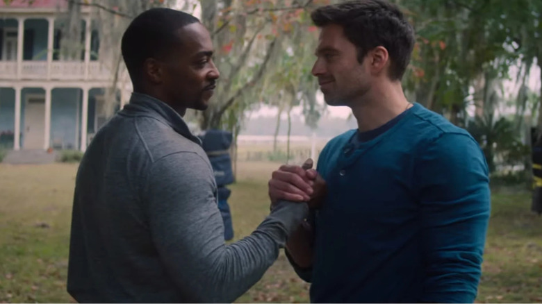 Anthony Mackie and Sebastian Stan holding hands