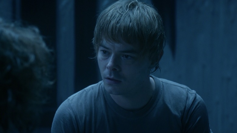 Jonathan Byers (Charlie Heaton) stares at Nancy Wheeler (Natalia Dyer) in Stranger Things