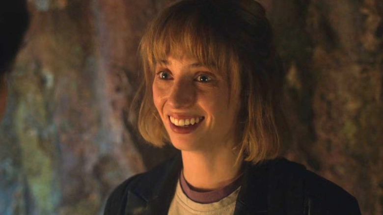 Robin Buckley (Maya Hawke) smiles widely in Stranger Things