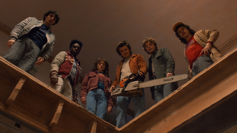 Finn Wolfhard as Mike Wheeler, Caleb McLaughlin as Lucas Sinclair, Natalia Dyer as Nancy Wheeler, Joe Keery as Steve Harrington, Charlie Heaton as Jonathan Byers, and Gaten Matarazzo as Dustin Henderson in Stranger Things season 5