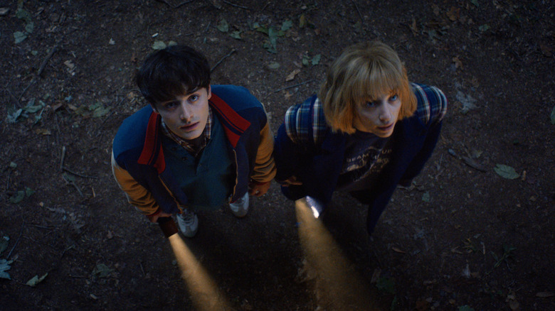 Will and Robin staring at the sky on Stranger Things