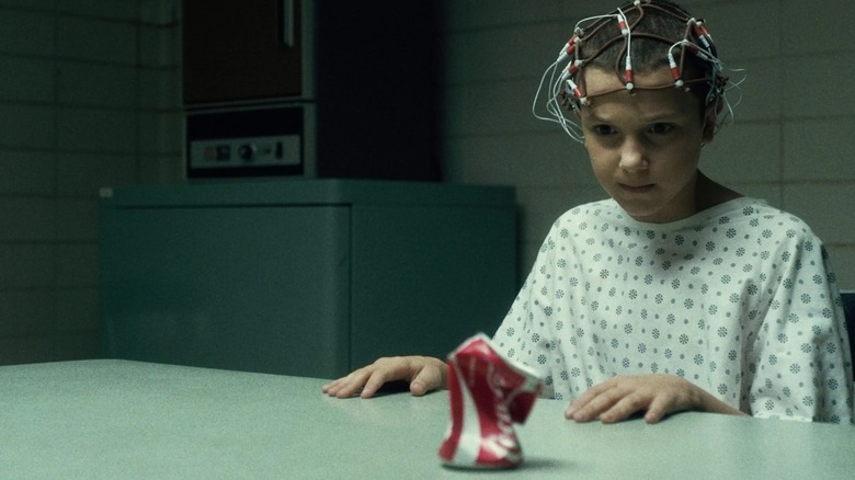 Eleven crushing a coke can with her mind in Stranger Things