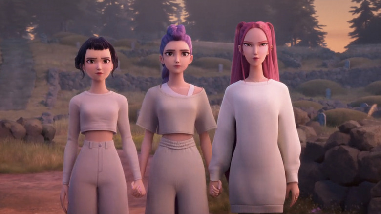 Zoey, Rumi, and Mira stand side by side outdoors in KPop Demon Hunters