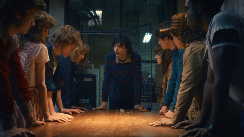 The principal gang gather around Will to hatch a plan in Stranger Things