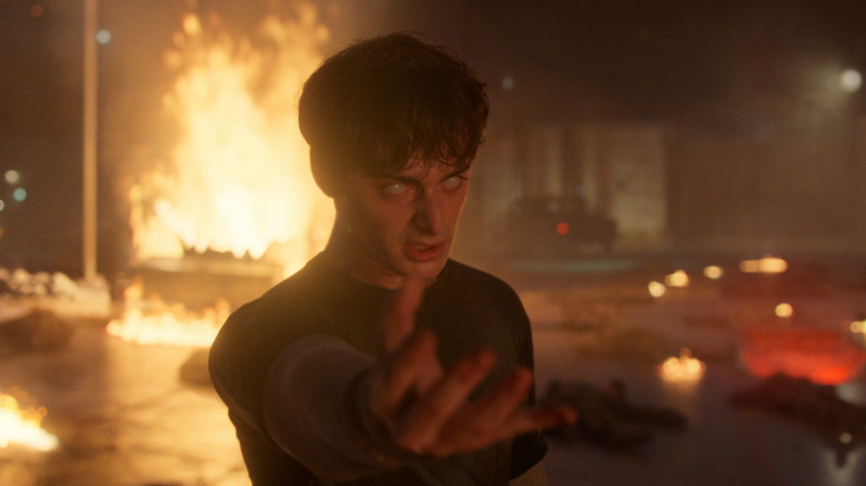 Will with glowing eyes using his powers against Vecna and the Demogorgons in Stranger Things 5