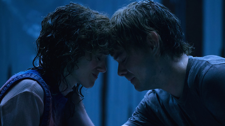 Nancy and Jonathan leaning their heads against each other in Stranger Things season 5